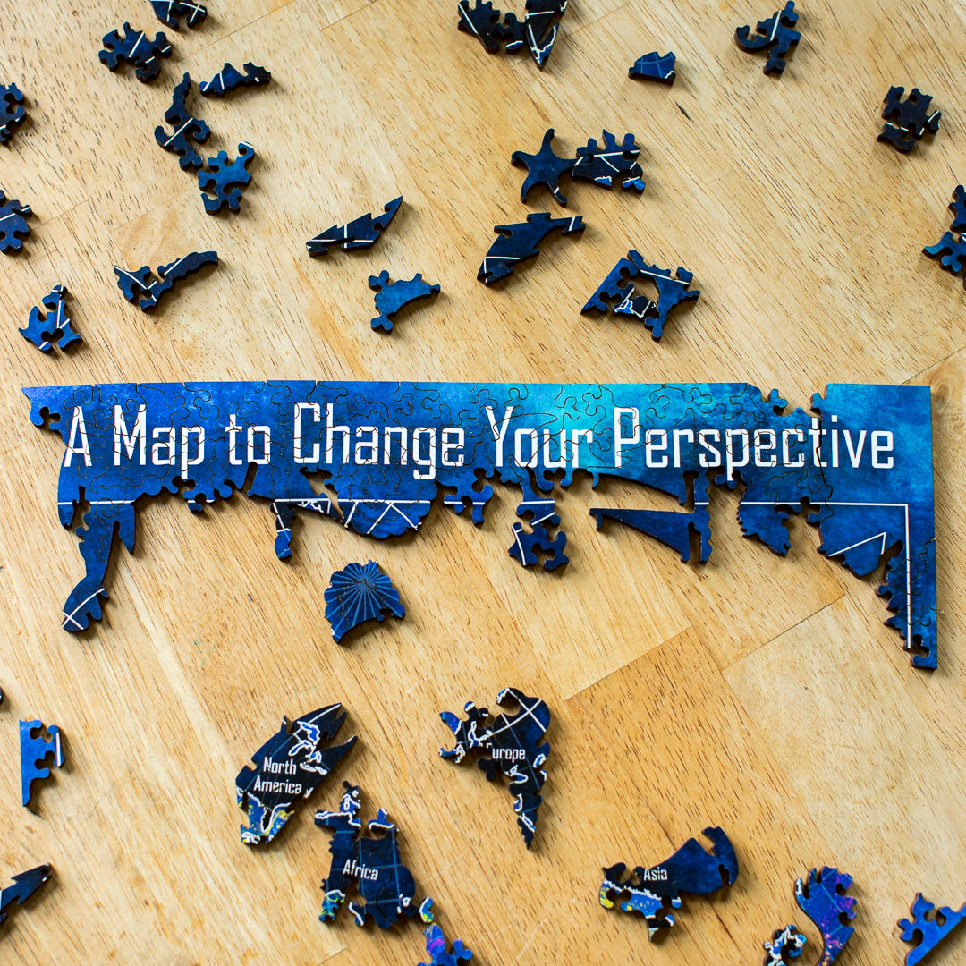 A close up of the puzzle being put together featuring the title, "A Map to Change Your Perspective" at the top.